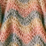Babyjacke mit Wellenrand häkeln