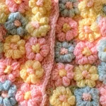 Babyjacke mit kleinen Blumen häkeln
